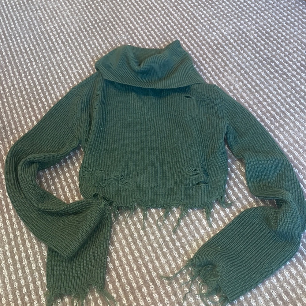 Green turtleneck sweater